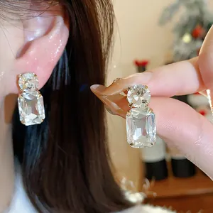 Elegant square cut clear crystal stud earrings with sparkling round stone details