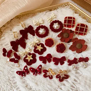 Elegant collection of red flocked bow and floral earrings for autumn and winter fashion