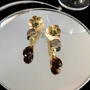 Retro ethnic style gold flower earrings with green crystal and brown teardrop charms