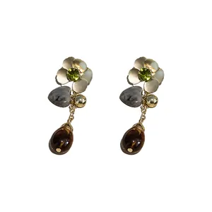 Elegant silver needle drop earrings with rhinestone flowers and heart charms