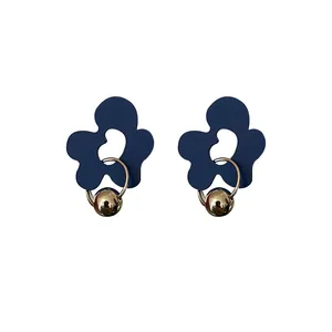 Chic Klein blue flower-shaped stud earrings featuring elegant gold hoops and beads