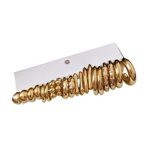 Elegant gold-toned chunky C-shaped stud earring set displayed on a white display card