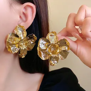 High-shine oversized gold metallic crumpled flower stud earrings for a bold fashion statement