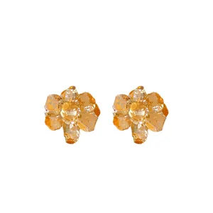 Elegant gold metallic crinkled flower stud earrings with steel pins on white background