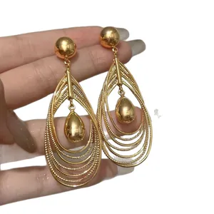 Elegant and fashionable multi-layer hollow teardrop pendant earrings with golden finish