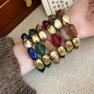 Bracciali elastici in acrilico geometrico retrò con glitter multicolore e finitura oro