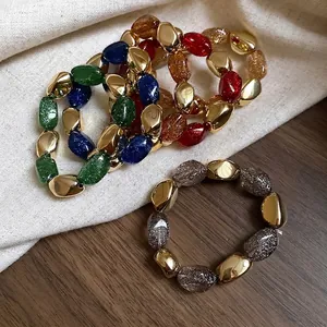 Bracciali elastici in acrilico vintage con perline in resina glitterata e dettagli oro
