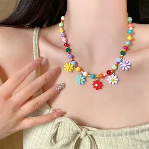 Colorful dopamine acrylic beaded necklace with flower pendants for sweet summer style.