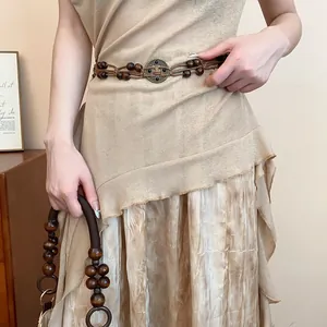 Detailed view of bohemian braided hemp rope waist chain with wooden beads