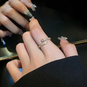 Elegant gold plated open ring featuring a zircon encrusted nail design for women