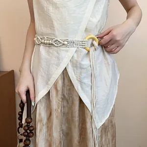 Close-up of Bohemian hand-woven rope belt with intricate patterns and wooden beads