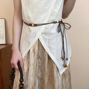 Bohemian multi-layer hemp rope waist chain featuring decorative wooden beads and knotted ties