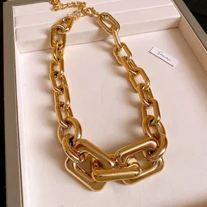 Chunky gold-plated statement necklace with interlocking punk style metal links