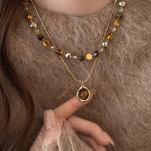 Vintage double-layer tiger eye stone necklace with elegant gold pendant for winter sweaters