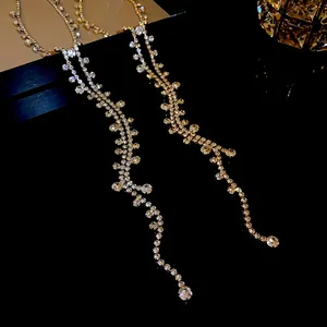 Elegant close-up view of sparkling rhinestone tassel necklaces in gold and silver finishes