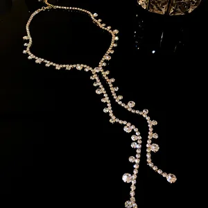 Elegant sparkling rhinestone tassel necklace with round geometric drop detail on black