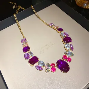 Exquisite close-up of luxury vintage necklace adorned with oversized purple and pink crystals