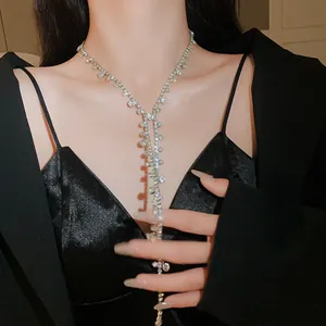 Elegant silver-tone necklace with sparkling rhinestones and long tassel drop detail.