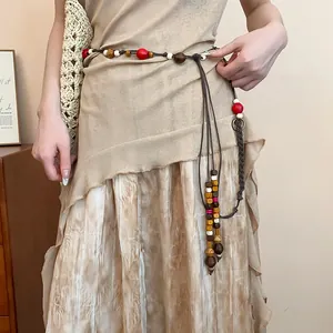 Detailed view of bohemian braided hemp rope waist chain with colorful wooden beads