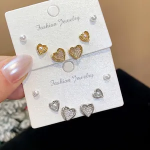 18k gold plated heart stud earrings with sparkling zircons and pearls on display cards