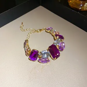 Close-up of multi-color crystal bracelet with purple and clear gemstones