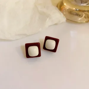 Retro Maillard style square stud earrings in brown and white finish.