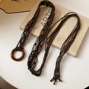 Handmade Bohemian brown woven rope waist chain featuring wooden beads and ring decor