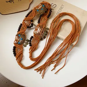 Handcrafted bohemian braided rope waist chain with dark wooden beads and moon charms in tan