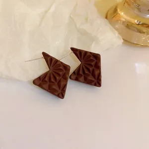 Chic matte brown geometric stud earrings featuring 3D starburst pattern in Maillard style