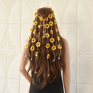 Detail view of bohemian sunflower headpiece with long beaded tassels on long hair