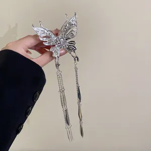 Elegant silver butterfly hair claw clip featuring long tassels and metallic finish