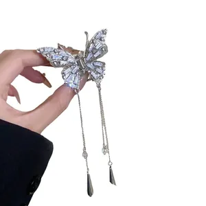 Sparkling silver butterfly hair claw clip with elegant long tassels and inlaid rhinestones