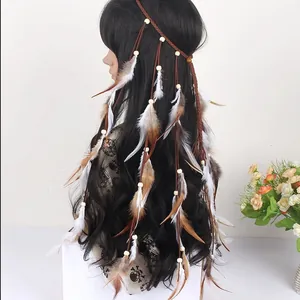 Detailed view of Bohemian feather headband with beads and long ethnic tassels.
