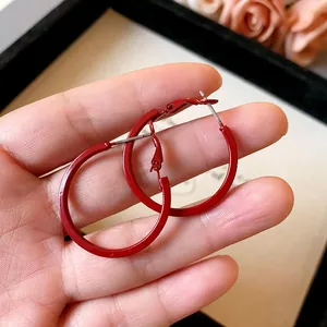 Vibrant red enamel hoop earrings with stainless steel posts for sensitive ears.