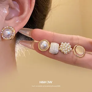 Elegant French vintage pearl stud earring set with geometric gold-plated designs for women