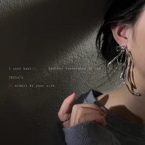 Elegant oversized silver bow earrings with rhinestones for a trendy Korean look