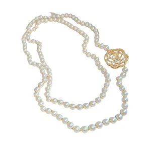 Elegant long pearl sweater necklace with hollow zircon camellia flower pendant for women