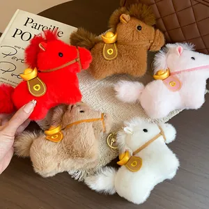 Detail macro view of cute plush horse keychains with gold sycee in various vibrant colors