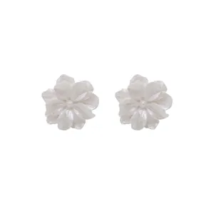 Minimalist white acrylic flower stud earrings with an elegant pearlescent finish for women