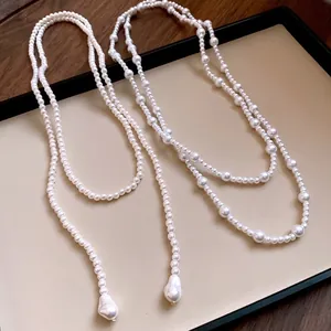 Elegant French vintage long pearl necklace and sweater chain with baroque pearl accents