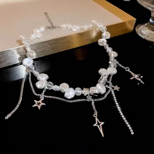 Elegant faux pearl necklace featuring cracked beads and sparkling star pendant charms