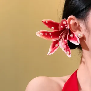 Elegant pink lily fabric hair clip with pearls for beach vacation hairstyles