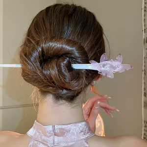 Elegant pink acetate butterfly hair stick for bun hairstyles in New Chinese style.