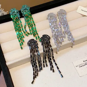 Detailed view of elegant silver needle zircon tassel earrings in three colors
