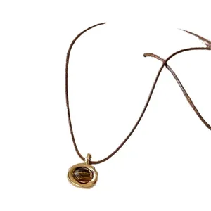 Vintage Maillard style oval pendant necklace with tiger eye stone and brown leather cord