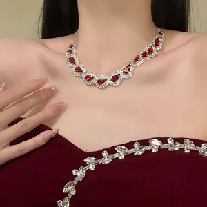 Detailed shot of an elegant luxury red water-drop rhinestone necklace set for women