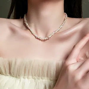 Detailed macro view of a colorful handmade beaded woven choker necklace on a model