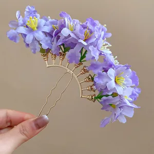 Elegant purple fabric flower hair pin with golden fan-shaped frame for beach holiday