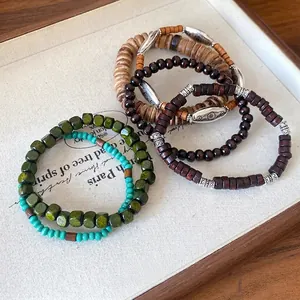 Bohemian style bracelet set with natural wood beads and coconut shell ethnic design.