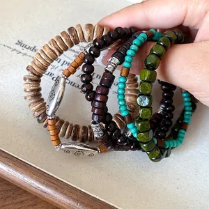 Bohemian vintage wood bead and coconut shell beaded bracelets with ethnic style accents.